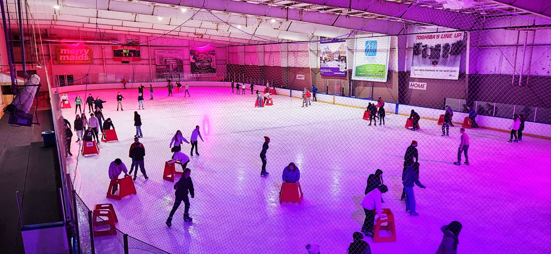 View of the full ice rink during a public skate session at Tim Hortons Iceplex