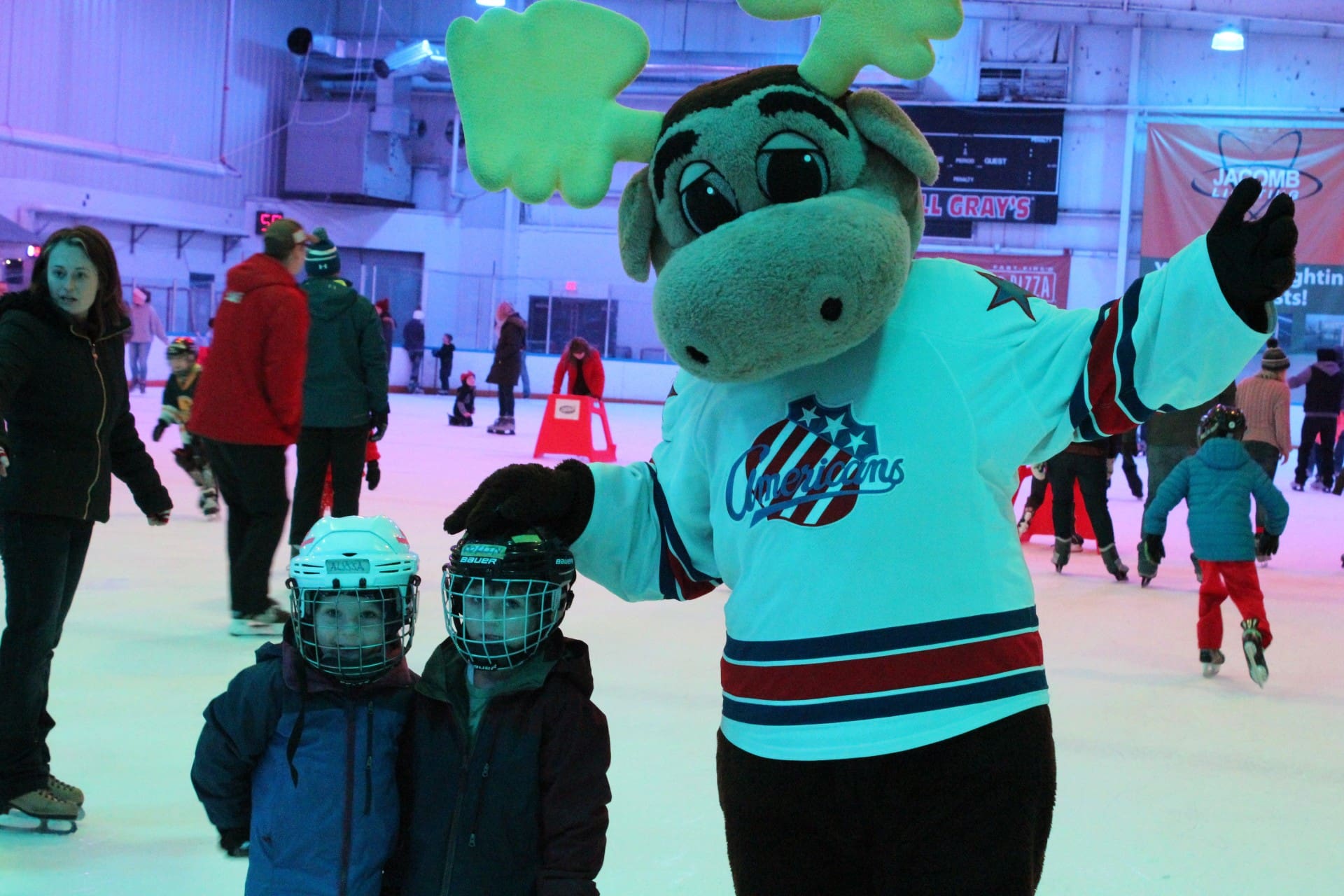 The Rochester Americans Moose mascot skating with children at Tim Hortons Iceplex